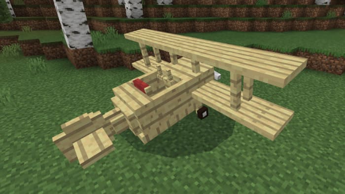 Игрок сидит в деревянном самолете 2